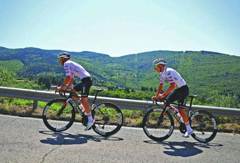 UAE Team Emirates’ Adam Yates and Tadej Pogacar during a training session in Florence on Friday. (Reuters)