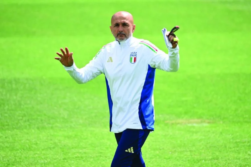 Italy&#039;s head coach Luciano Spalletti talks to his players during an MD-1 training session at the base camp in Iserlohn on Friday, on the eve of their UEFA Euro 2024 Round of 16 football match against Switzerland. (AFP)