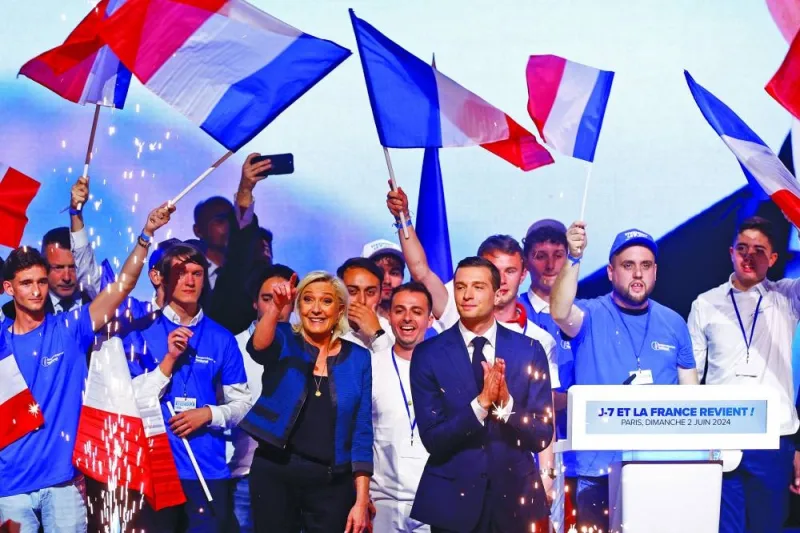 
FILE PHOTO: Marine Le Pen, President of the French far-right National Rally (Rassemblement National - RN) party parliamentary group, and Jordan Bardella, President of the French far-right National Rally party and head of the RN list for the European elections, attend a political rally during the party’s campaign for the EU elections, in Paris, on June 2, 2024. 