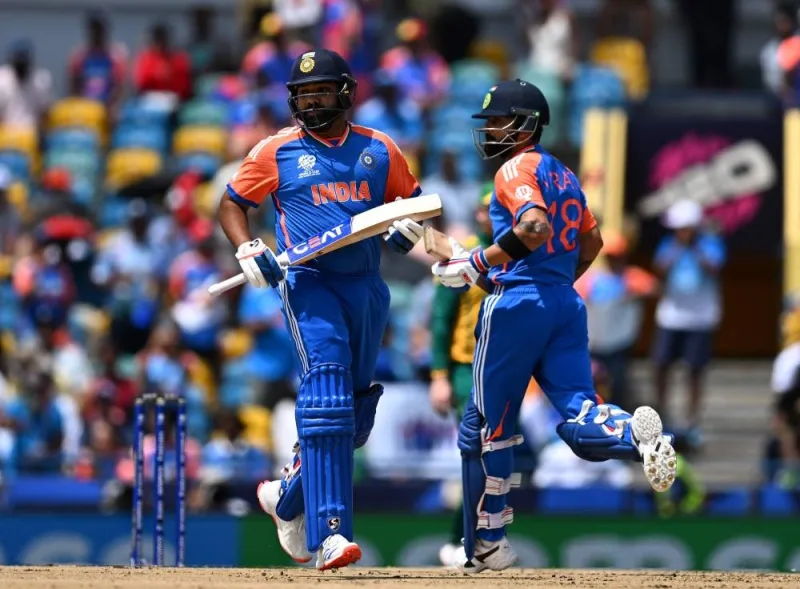 India&#039;s Virat Kohli (R)and India&#039;s captain Rohit Sharma run between the wickets during the ICC men&#039;s Twenty20 World Cup 2024 final cricket match between India and South Africa at Kensington Oval in Bridgetown, Barbados. AFP