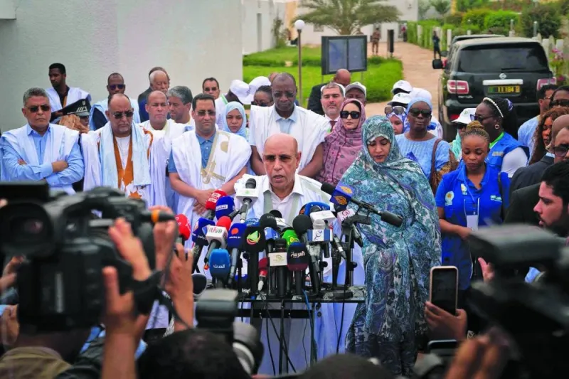 
Incumbent Mauritanian President Mohamed Ould Ghazouani speaks to reporters after having cast his vote at a polling station in Nouakchott, yesterday. 