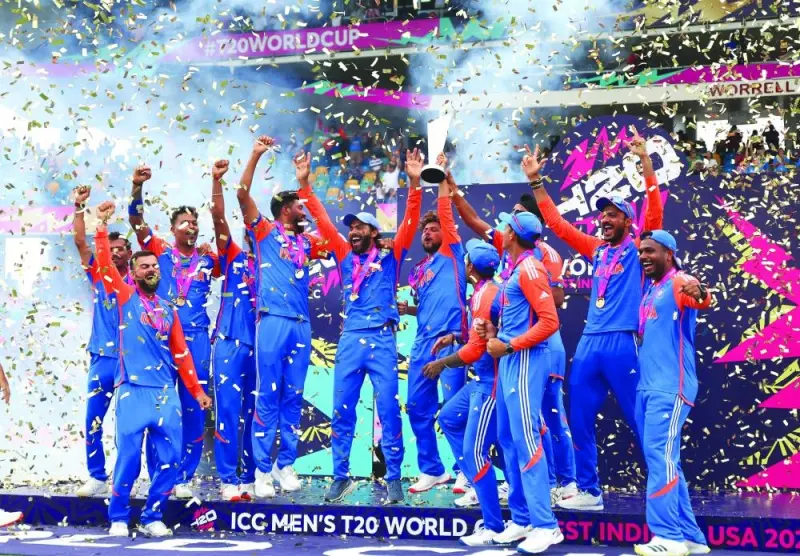 India’s Kuldeep Yadav lifts the trophy as team celebrates after winning the T20 World Cup in Bridgetown, Barbados, on Saturday. (Reuters)