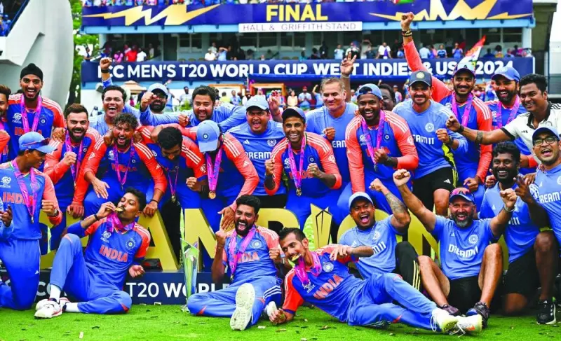 India celebrates with the trophy after winning the ICC Twenty20 World Cup 2024 final against South Africa at Kensington Oval in Bridgetown, Barbados, on Saturday. (AFP)