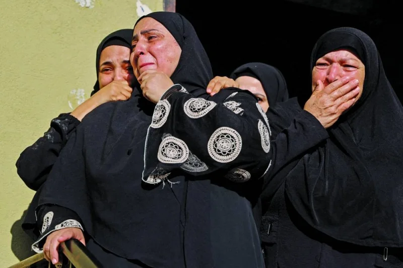 Palestinian women attend the funeral of Saeed Jaber, who was killed when Israeli forces hit a house, in Nur Shams camp, in Tulkarm, in the occupied West Bank, yesterday.