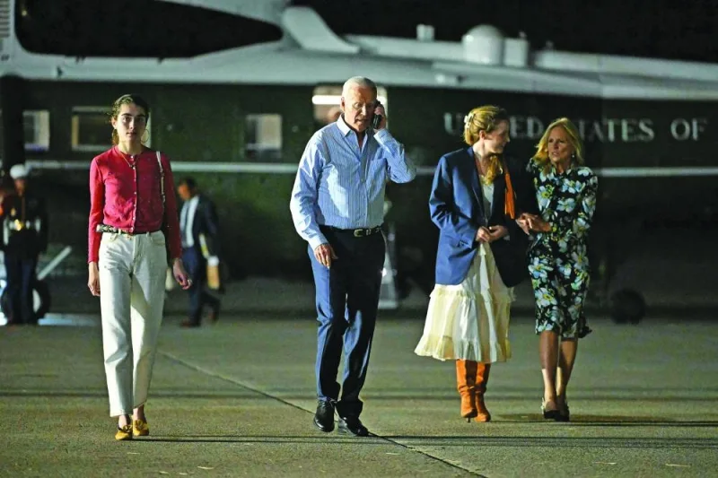 US President Joe Biden and First Lady Jill Biden, alongside granddaughters Natalie (L) and Finnegan (2nd R), make their way to board Air Force One before departing McGuire Air Force Base in Burlington, New Jersey on June 29, 2024. Biden is heading to the Camp David presidential retreat where he was expected to spend the rest of the weekend. (Photo by Mandel NGAN / AFP)