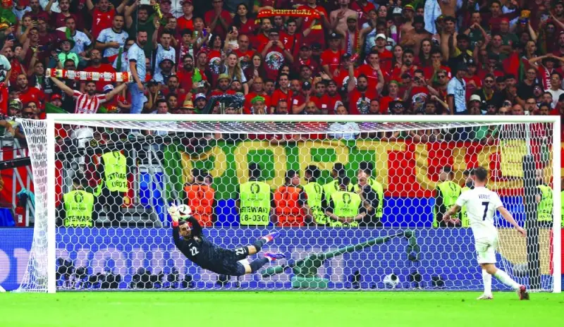 Portugal’s Diogo Costa saves a shot from Slovenia’s Benjamin Verbic during the penalty shootout in their Euro 2024 Round of 16 match in Frankfurt on Monday. (Reuters)