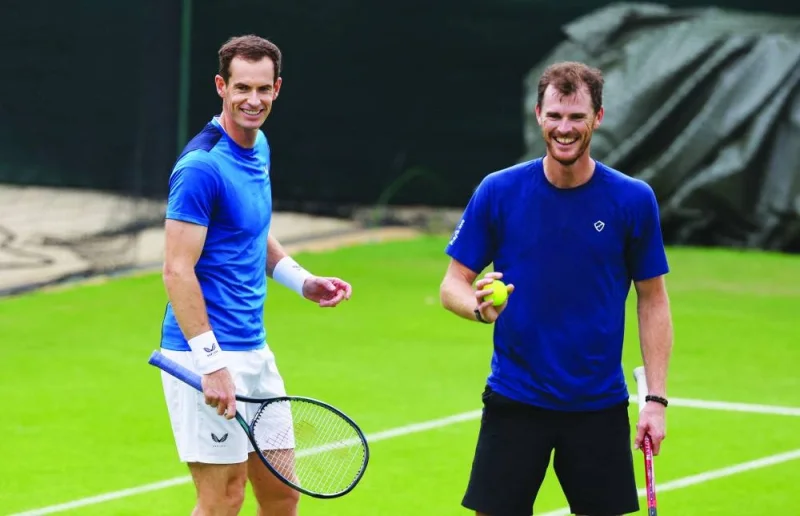 Brothers Andy (left) and Jamie Murray of Britain during a practice session at the All England Lawn Tennis and Croquet Club, London, Britain, on Tuesday. (Reuters) 