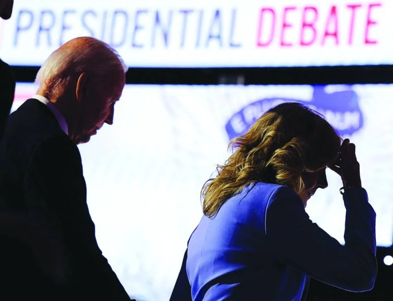 
Democrat candidate US President Joe Biden walks offstage with first lady Dr Jill Biden at the conclusion of a presidential debate with Republican presidential candidate and his predecessor Donald Trump, in Atlanta, Georgia, on Thursday. (Reuters) 