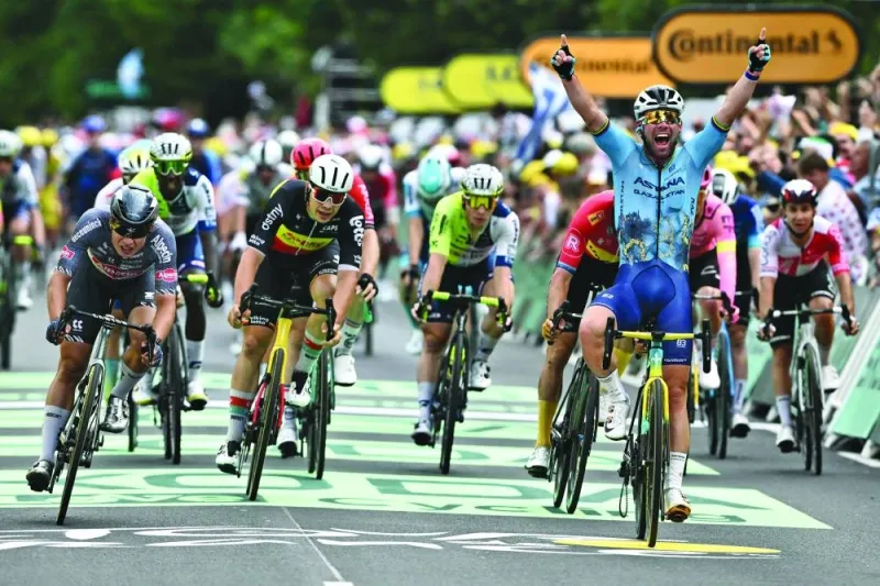 
Astana Qazaqstan Team’s British rider Mark Cavendish celebrates as he cycles past the finish line to win the 5th stage of the 111th edition of the Tour de France. (AFP) 
