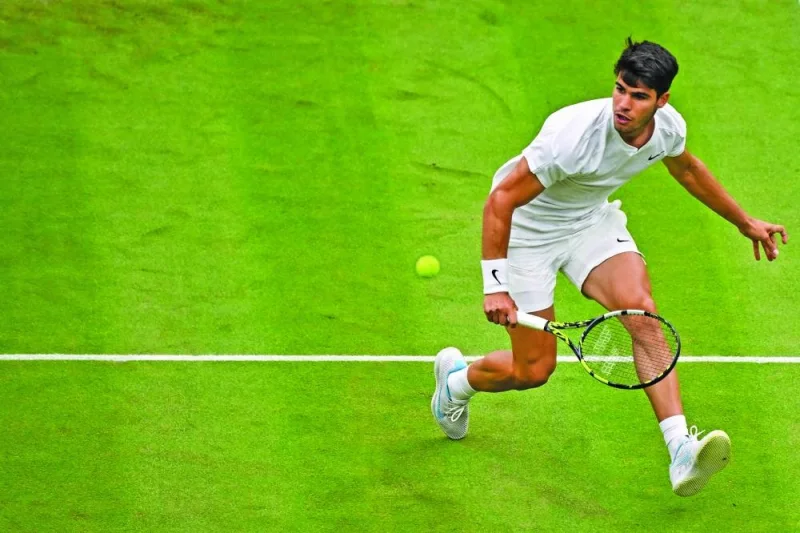 Spain’s Carlos Alcaraz returns against Australia’s Aleksander Vukic during their second round match on the third day of the 2024 Wimbledon Championships on Wednesday. (AFP)