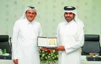 Abdulla A al-Mansoori and Sheikh Naif bin Eid al-Thani at the MoU signing.