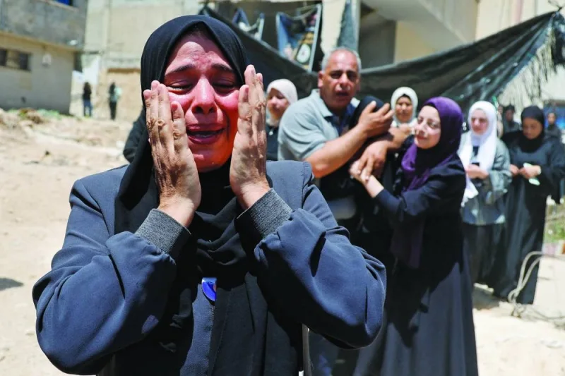 A woman reacts during the funeral of four Palestinians killed in an Israeli airstrike, in Nur Shams camp, in Tulkarm, in the West Bank, on Wednesday.