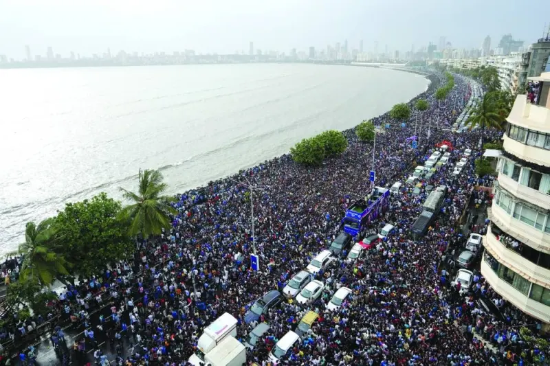Fans wait for the arrival of Indian cricket team members for a victory parade to celebrate winning the ICC men&#039;s T20 World Cup, along the Marine Drive in Mumbai on Thursday. (Reuters)