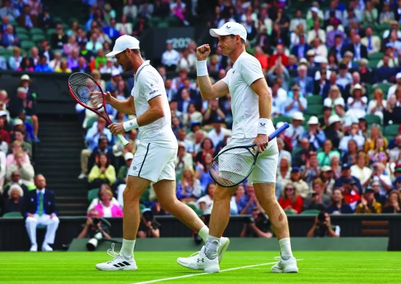 Britain’s Andy Murray and Britain’s Jamie Murray react during the doubles first round match against Australia’s John Peers and Rinky Hijikata at Wimbledon in London on Thursday. Peers and Hijikata won 7-6, 6-4. (Reuters)
