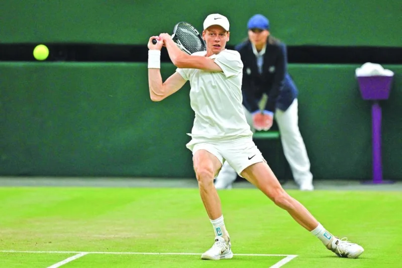 Italy’s Jannik Sinner returns against Serbia’s Miomir Kecmanovic on the fifth day of the 2024 Wimbledon Championships in London on Friday. (AFP)