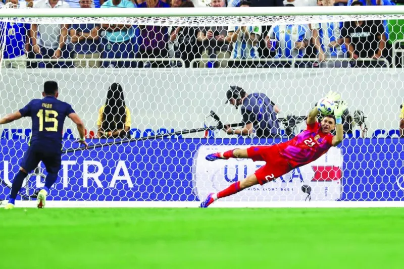 
Argentina’s goalkeeper Emiliano Martinez saves a spot kick from Ecuador’s Angel Mena in a penalty shootout during the Conmebol 2024 Copa America quarter-final at NRG Stadium in Houston. (AFP) 