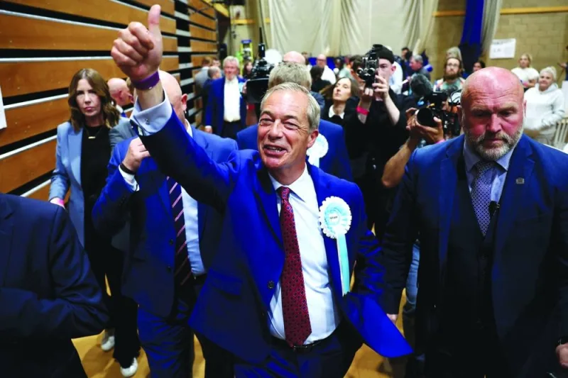 Reform UK leader Nigel Farage reacts after being elected to become MP for Clacton at the Clacton count centre in Clacton-on-Sea, eastern England, early on Friday.