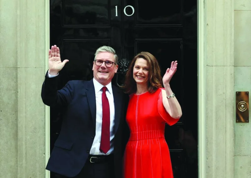 Incoming Prime Minister Keir Starmer and his wife Victoria arrive at Number 10 Downing Street, following the results of the election, in London, Britain, on Friday.