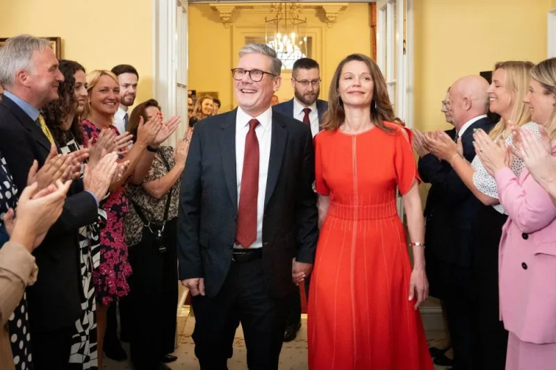 
Newly elected UK Prime Minister Sir Keir Starmer and his wife Victoria Starmer are clapped in by staff as they enter his official London residence at No 10 Downing Street for the first time after the Labour Party won a landslide victory at the 2024 General Election. 