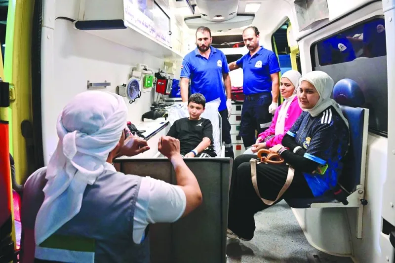 
An ambulance transporting an injured Palestinian boy and his family members evacuated from the Gaza Strip, arrives to the Emirati floating hospital in the Egyptian port of Al-Arish. 
