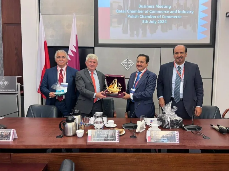 Qatar Chamber chairman Sheikh Khalifa bin Jassim al-Thani handing over a token of recognition to Polish Chamber of Commerce president Dr Marek Kłoczko, in the presence of Qatar Chamber first vice-chairman Mohamed bin Towar al-Kuwari during the meeting.