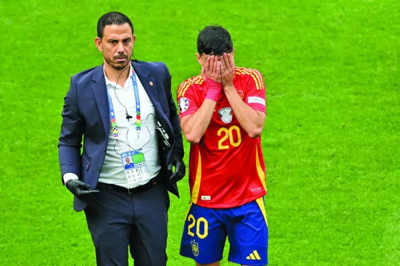 Spain’s midfielder Pedri leaves the pitch after being injured during the Euro 2024 quarter-final against Germany in Stuttgart on Saturday. (AFP)