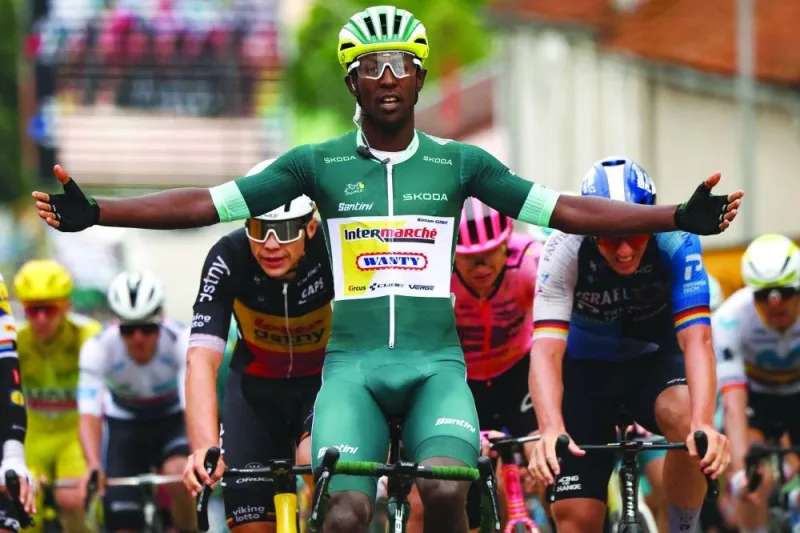 Eritrean rider Biniam Girmay wearing the sprinter’s green jersey cycles to the finish line to win the 8th stage of the 111th edition of the Tour de France cycling race, 183.5km between Semur-en-Auxois and Colombey-les-deux-Eglises, on Saturday. (AFP)