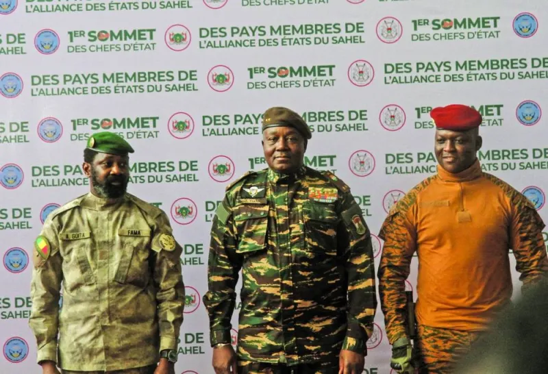 Heads of state of Mali’s Assimi Goita, Niger’s General Abdourahamane Tiani and Burkina Faso’s Captain Ibrahim Traore pose for photographs during the first ordinary summit of heads of state and governments of the Alliance of Sahel States in Niamey, Niger, yesterday.