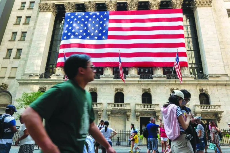 People walk by the New York Stock Exchange. Hopes that the US stocks rally will broaden beyond megacaps like Nvidia will be tested in coming weeks as investors learn whether profit growth from other companies is starting to catch up with that of the tech-related leaders.