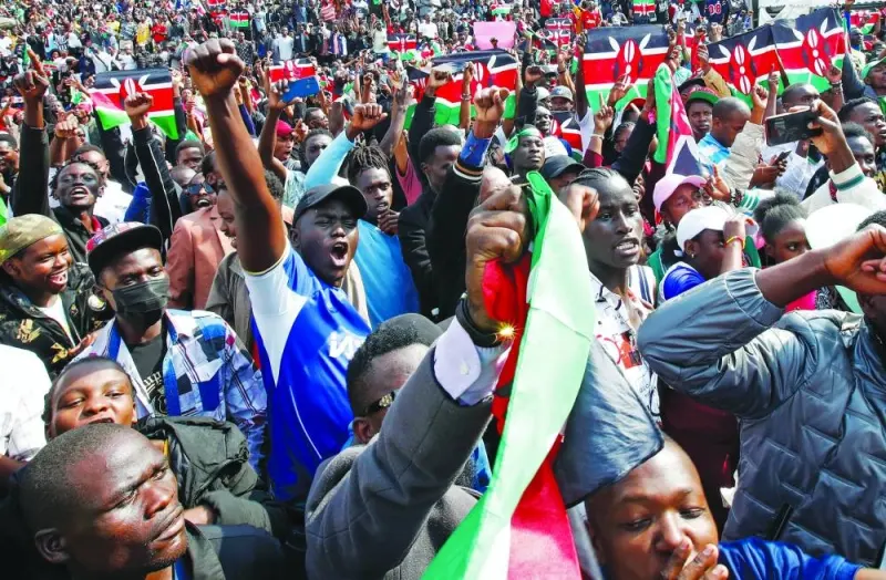 People react during a concert in memory of people who were killed during a demonstration against the imposition of tax hikes by the government, in Nairobi, yesterday.