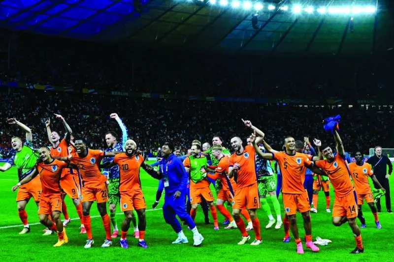 Netherlands players celebrate after the UEFA Euro 2024 quarter-final against Turkiye at the Olympiastadion in Berlin. (AFP)