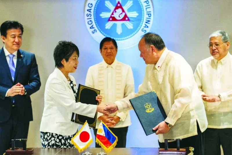 
Japan’s Foreign Minister Yoko Kamikawa and Philippine’s Defence Minister Gilberto Teodoro shake hands after signing the reciprocal access agreement, at the Malacanang Palace in Manila, Philippines, yesterday. 