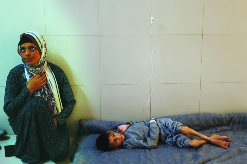 
Palestinian mother Ghaneyma Joma sits next to her malnourished son Younis Joma as he receives treatment at Nasser hospital in Khan Younis, in the southern Gaza Strip. 