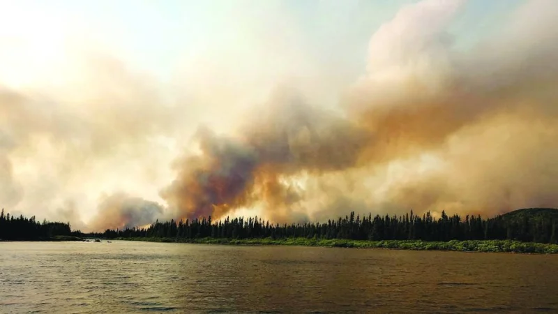 One of the wildfires near Labrador City, Canada. – Reuters
