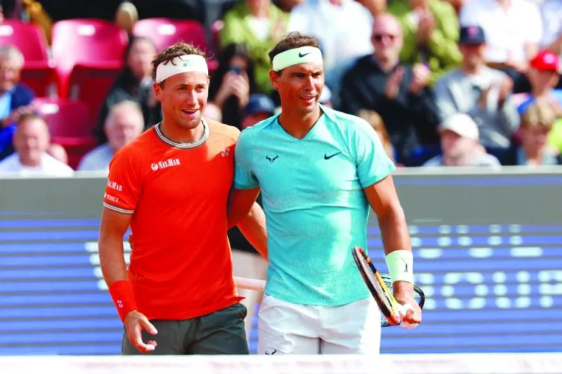 Spain’s Rafael Nadal (right) and Norway’s Casper Ruud react after winning the doubles match against Argentina’s Guido Andreozzi and Mexico’s Miguel Reyes-Varela during the Nordea Open ATP tennis tournament in Bastad, Sweden, on Monday. (AFP)