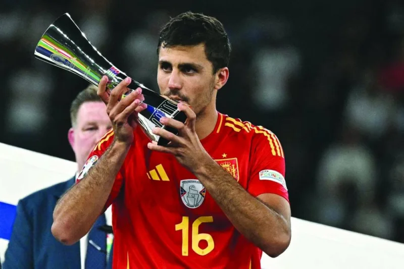 
Spain’s midfielder Rodri kisses his best player trophy after Euro 2024 final against England in Berlin. (AFP) 