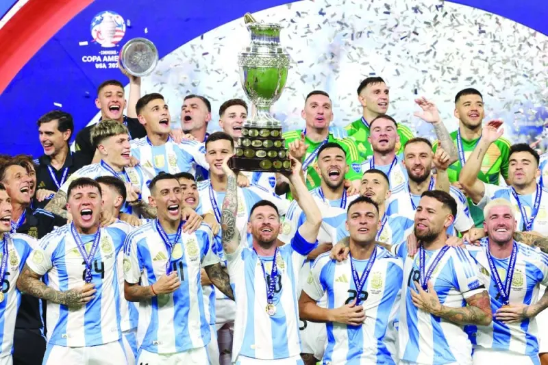 
Argentina’s forward Lionel Messi lifts up the trophy as he celebrates with teammates after winning the CONMEBOL 2024 Copa America final against Colombia at the Hard Rock Stadium in Miami. (AFP) 