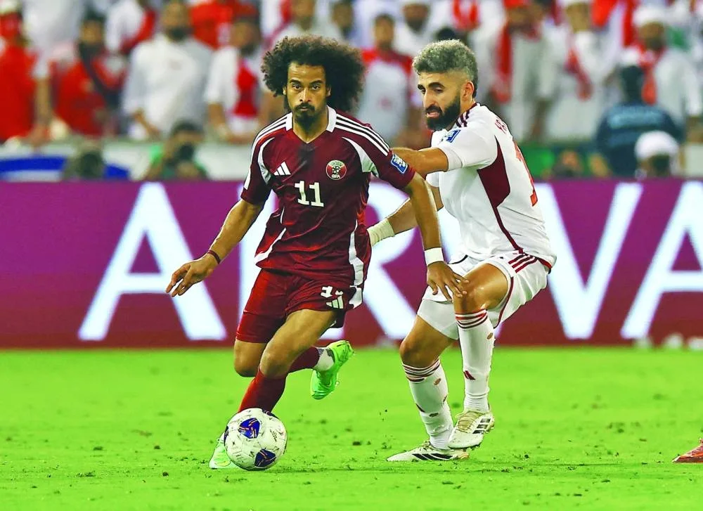 Qatar&#039;s Akram Afif in action with United Arab Emirates&#039; Yahia Nader. REUTERS
