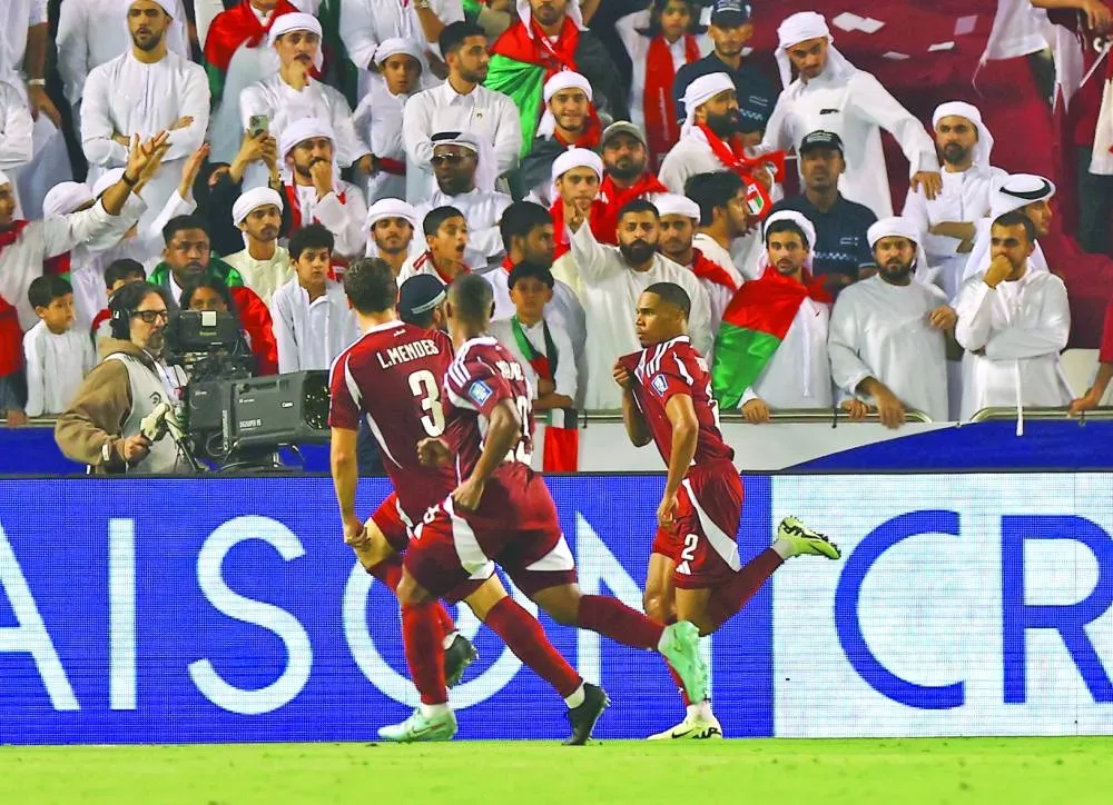 Qatar&#039;s Pedro Miguel celebrates scoring their second goal with teammates. REUTERS
