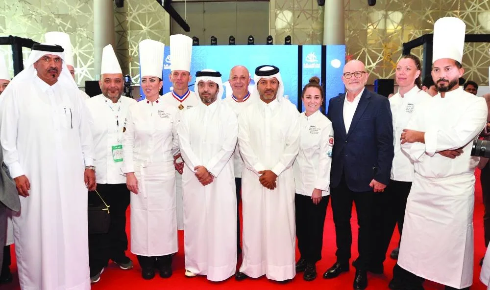 HE Saad bin Ali al-Kharji with participating chefs at the event.