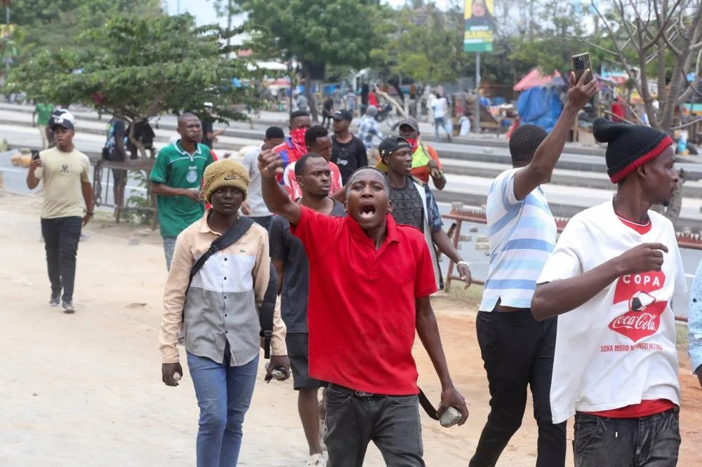Demonstrators participate in violent protests that marred the election following the disqualification of the two leading opposition candidates in Dar es Salaam, Tanzania, on Wednesday. REUTERS