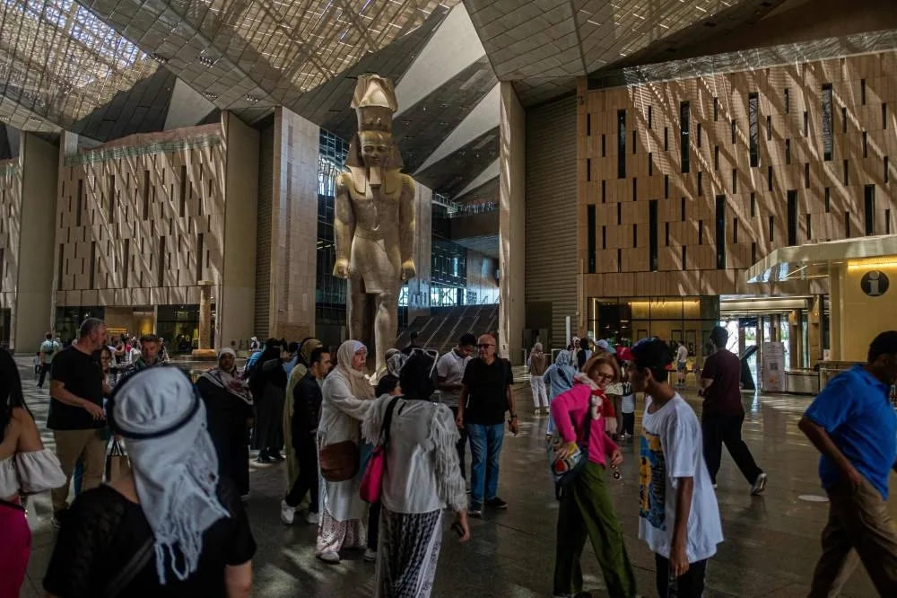 (FILES) Visitors tour the Grand Egyptian Museum in Giza on the southwestern outskirts of the capital Cairo on May 5, 2025. (AFP)