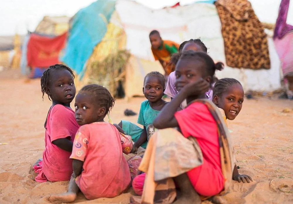 Displaced Sudanese children who fled with their families during violence in El-Fasher, sit inside a camp shelter, in Tawila, North Darfur, on Monday. REUTERS