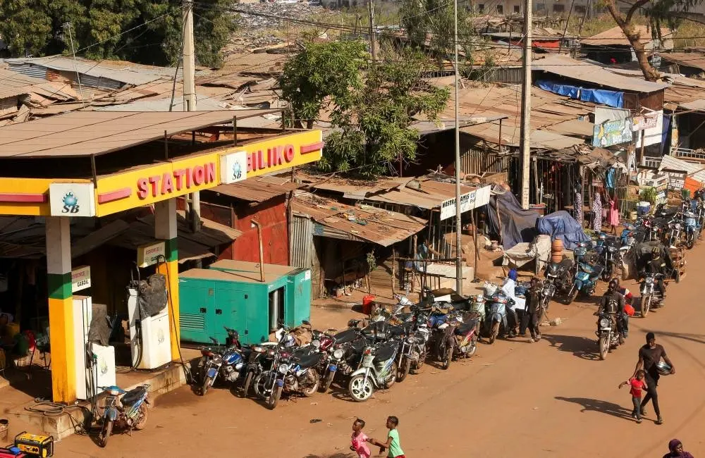 Photo taken on October 31, 2025, shows motorcycles line up near a closed petrol station, amid ongoing fuel shortages caused by a blockade imposed by Al Qaeda-linked insurgents in early September, in Bamako, Mali.