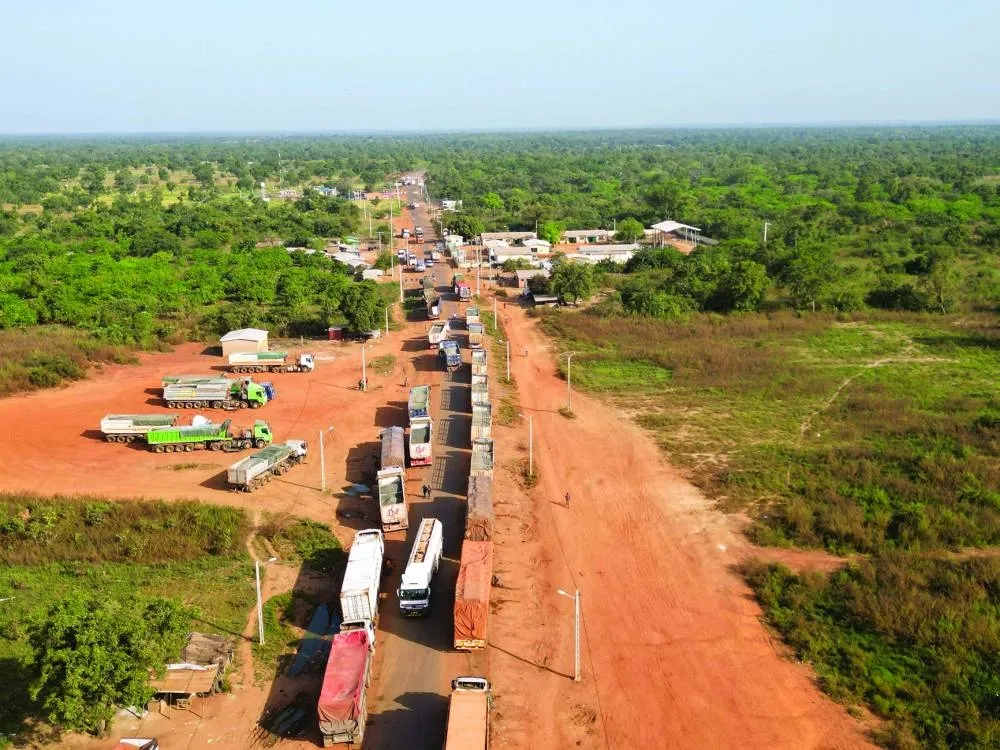 This aerial view shows Malian trucks waiting to cross the border between Ivory Coast and Mali in the village of Nigoun, near Tengrela on October 31, 2025. 