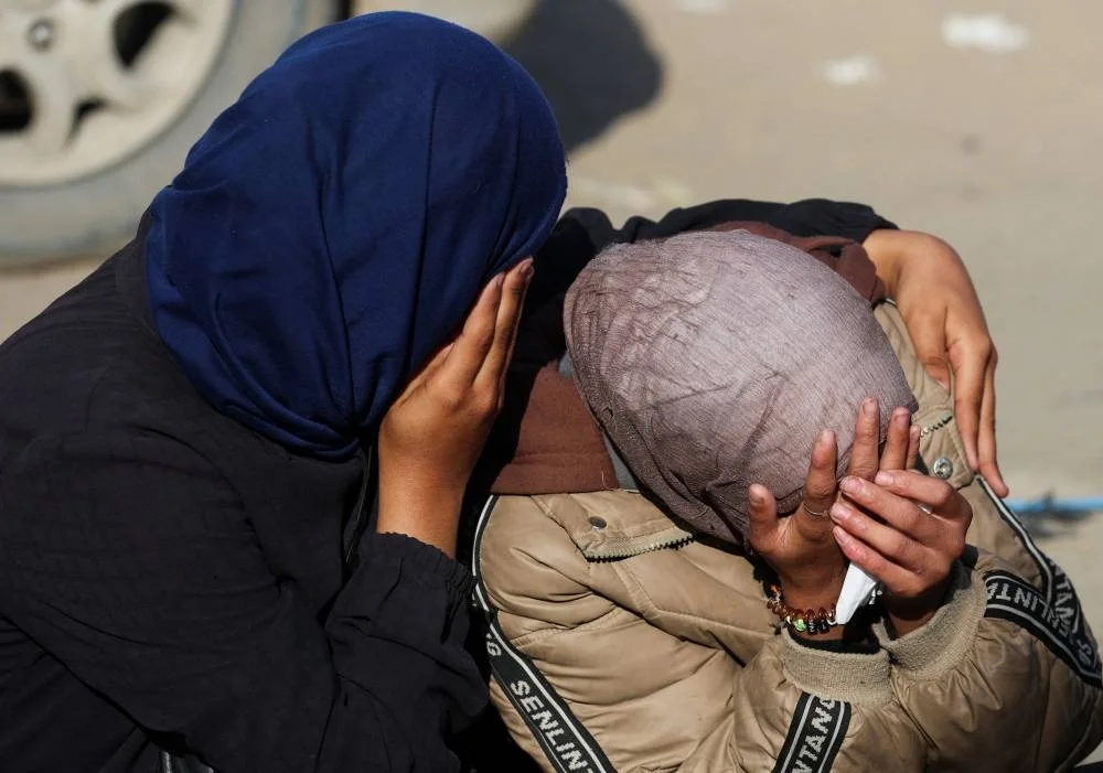 Mourners react as they attend the funeral of Palestinians who, according to medics, were killed in overnight Israeli strikes, at Nasser Hospital in Khan Younis, in the southern Gaza Strip, November 20, 2025. REUTERS