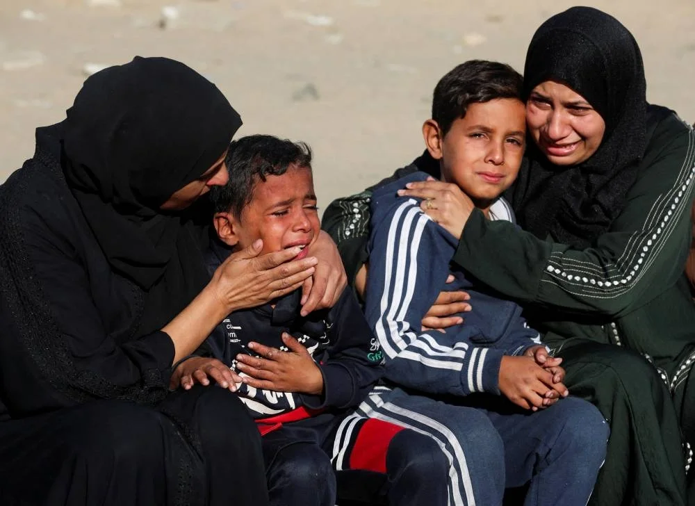 Mourners react as they attend the funeral of Palestinians who, according to medics, were killed in overnight Israeli strikes, at Nasser Hospital in Khan Younis, in the southern Gaza Strip, November 20, 2025. REUTERS