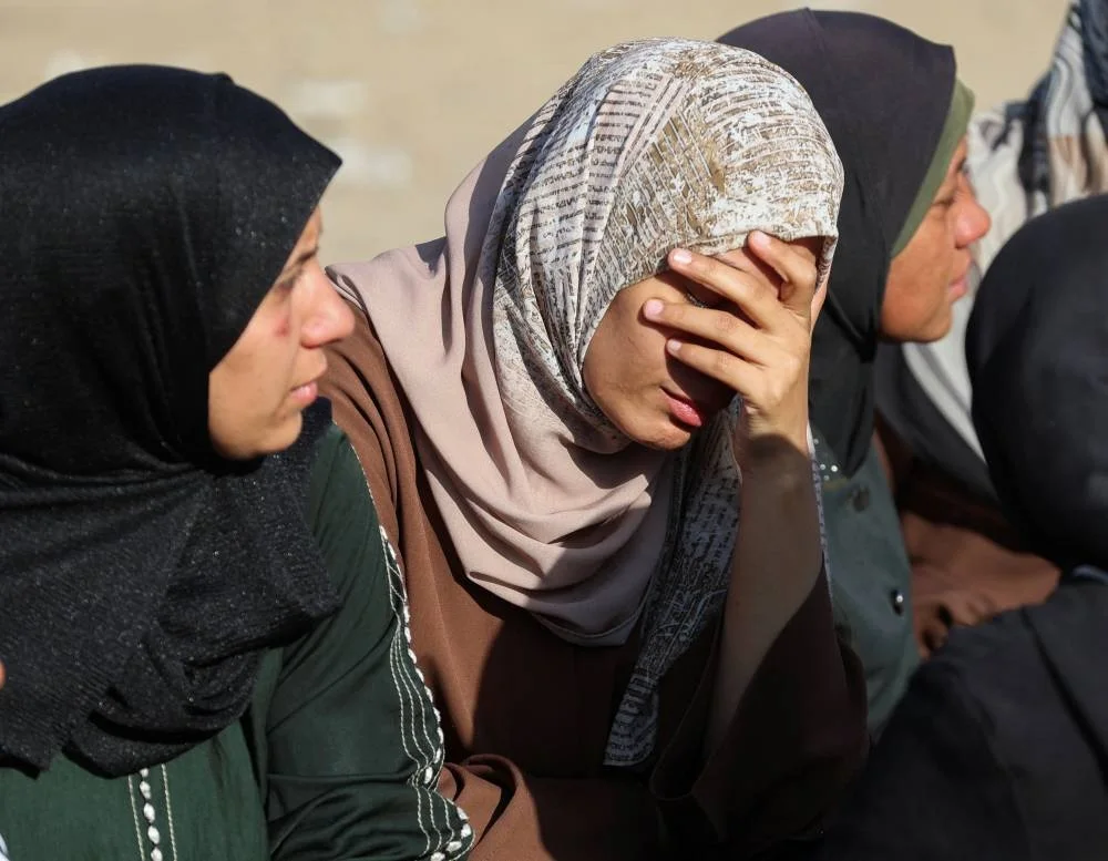 Mourners react as they attend the funeral of Palestinians who, according to medics, were killed in overnight Israeli strikes, at Nasser Hospital in Khan Younis, in the southern Gaza Strip, November 20, 2025. REUTERS