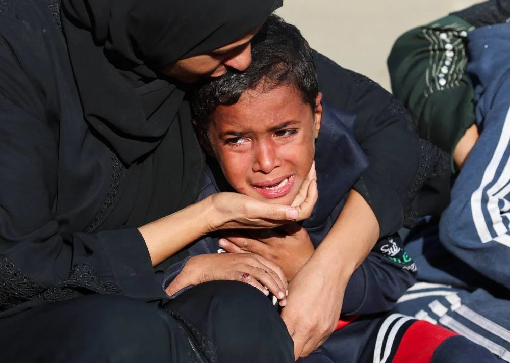 Mourners react as they attend the funeral of Palestinians who, according to medics, were killed in overnight Israeli strikes, at Nasser Hospital in Khan Younis, in the southern Gaza Strip, November 20, 2025. REUTERS