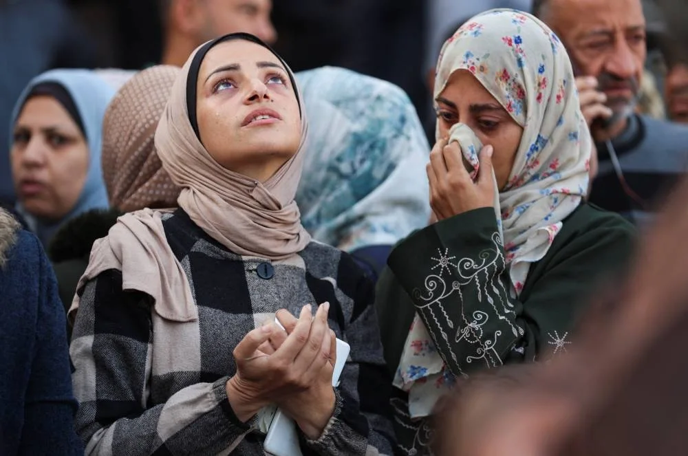 Mourners react as they attend the funeral of Palestinians who, according to medics, were killed in overnight Israeli strikes, at Nasser Hospital in Khan Younis, in the southern Gaza Strip, November 20, 2025. REUTERS